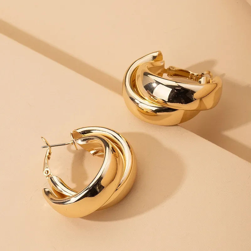 Boucles d’Oreilles Torsadées – Or & Argent