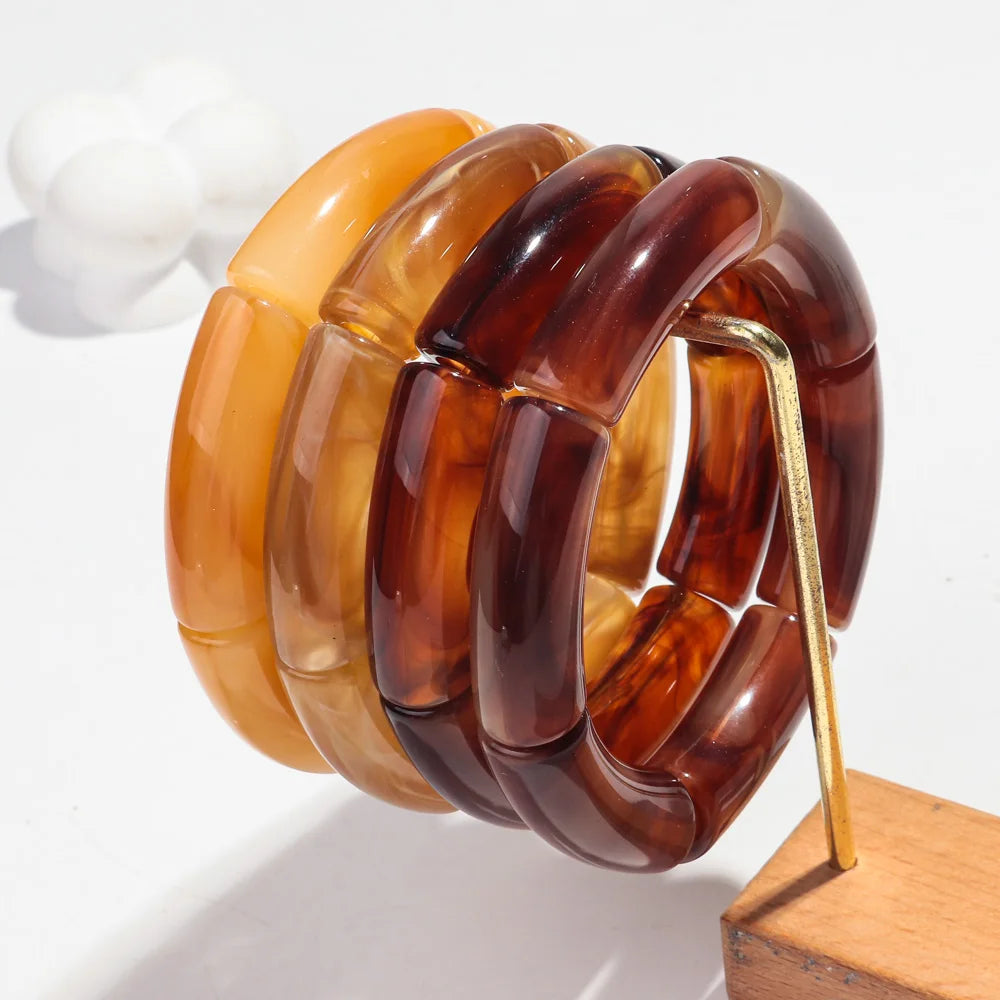 Boucles_d_oreilles_marron_ambre_par_deux